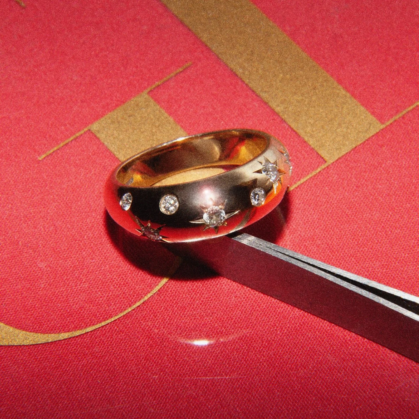 A recent bespoke commission. Domed yellow gold band set with a mix of rub over and star set diamonds.