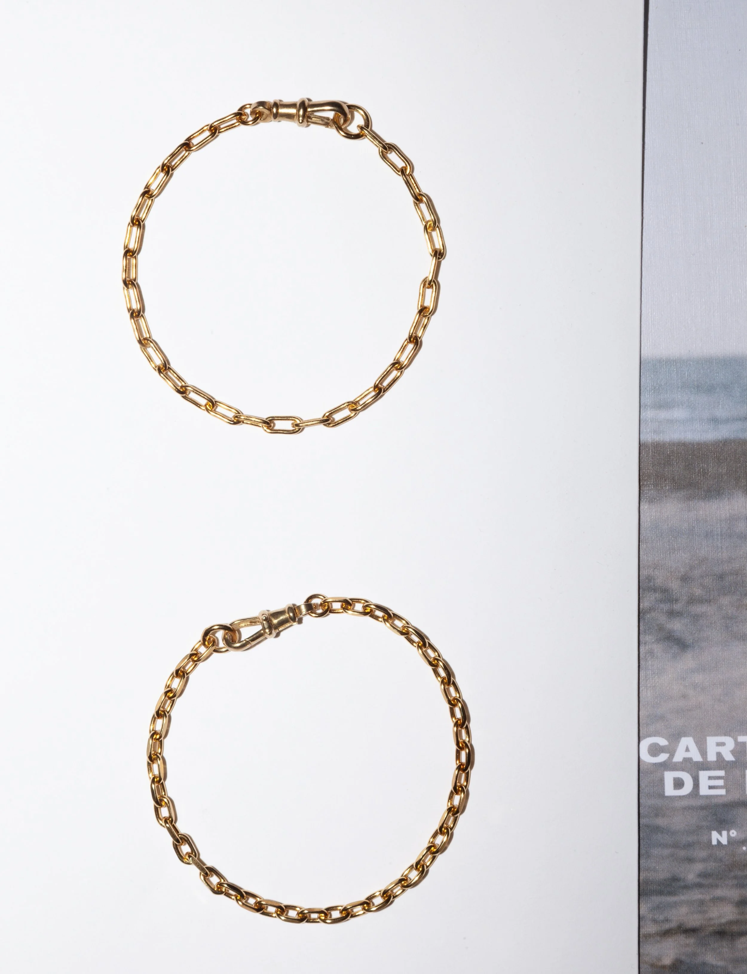 Swivel clasp bracelets available in two styles, paperclip and flat trace.

The perfect everyday bracelets.
