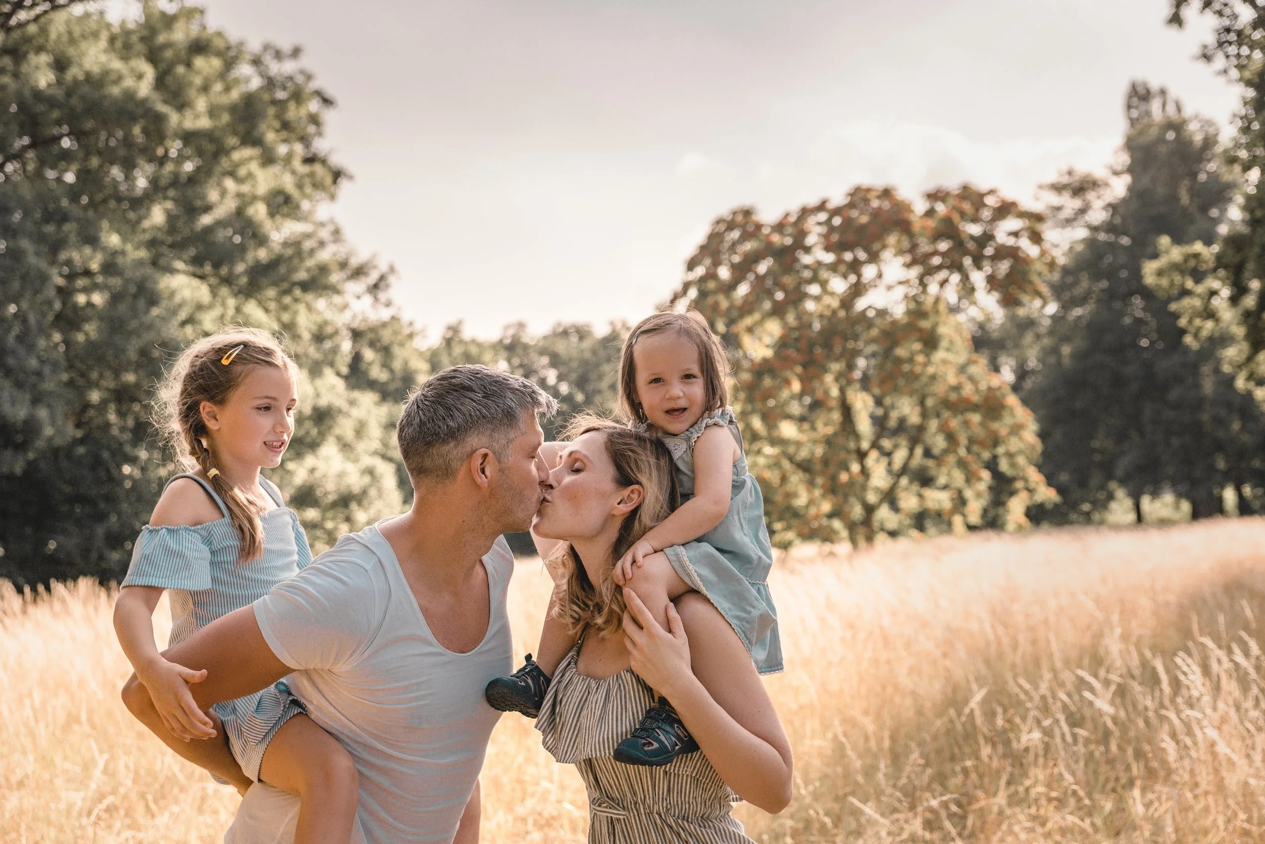 family with children in a field