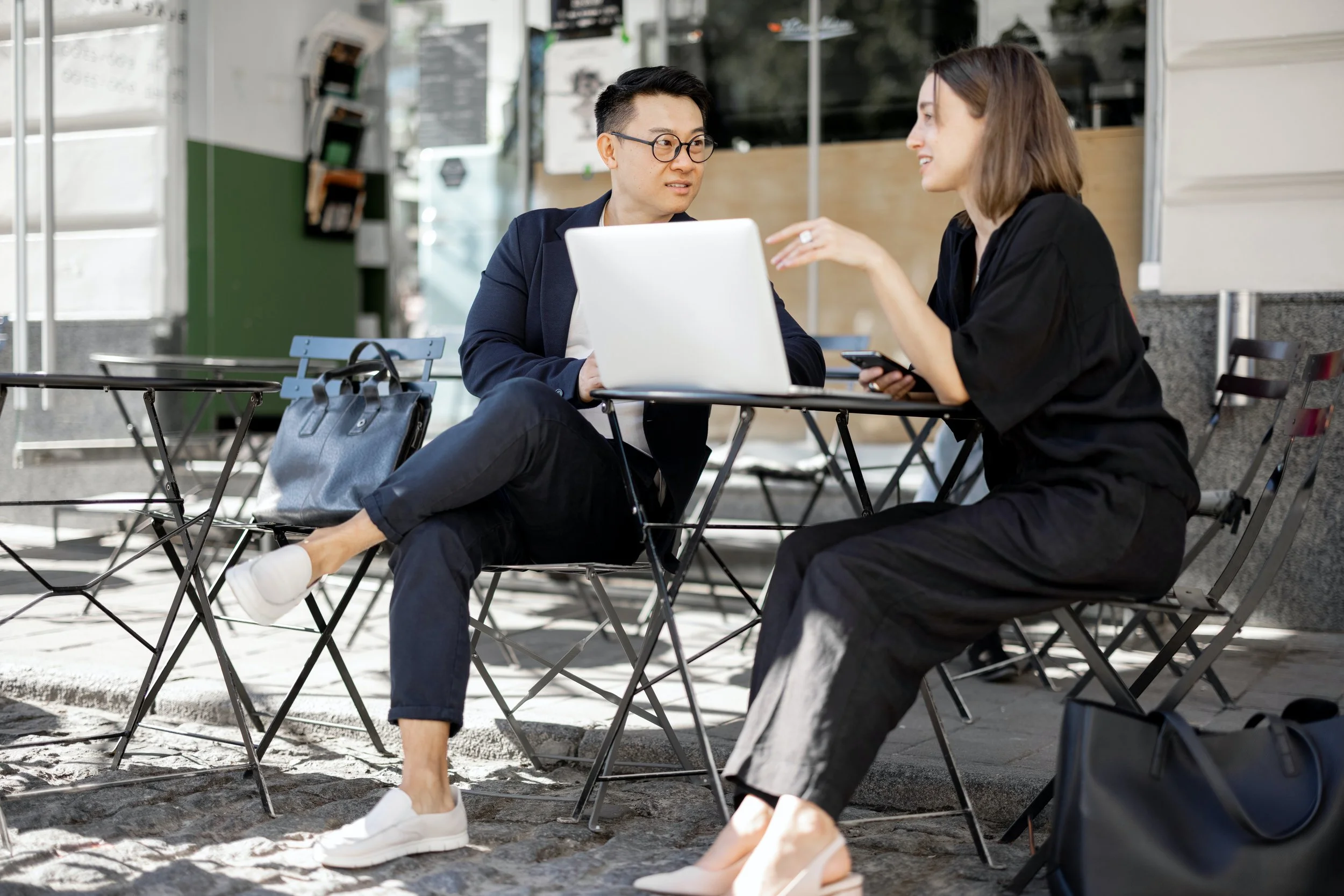 young couple working at a cafe