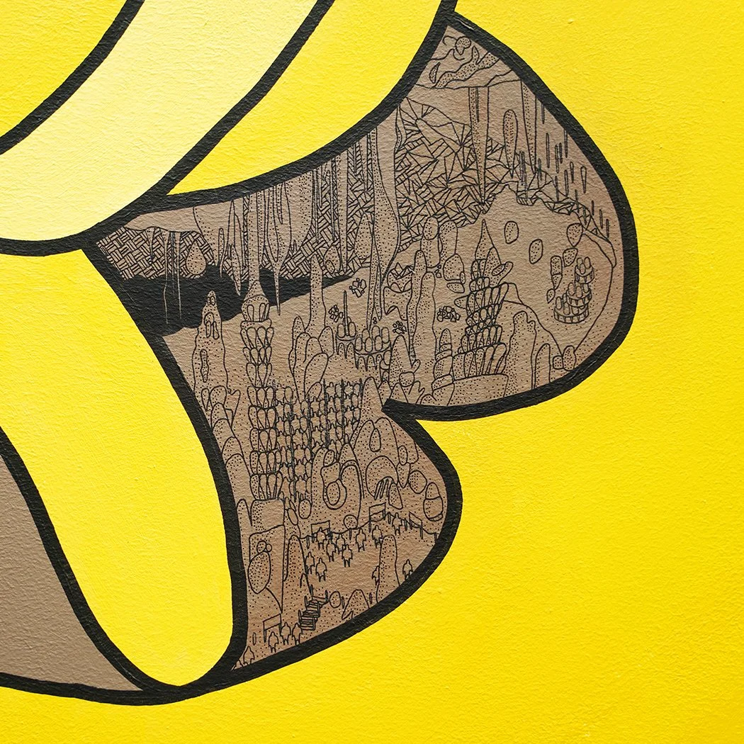 Detail of large yellow acrylic painting with black lines and colourful details