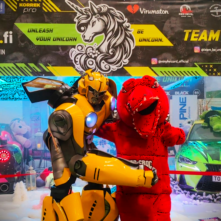 Rengas, jossa väreissä: punainen, violetti, keltainen, sininen, vihreä, oranssi ja punainen ja teksti "Lasten kierros"