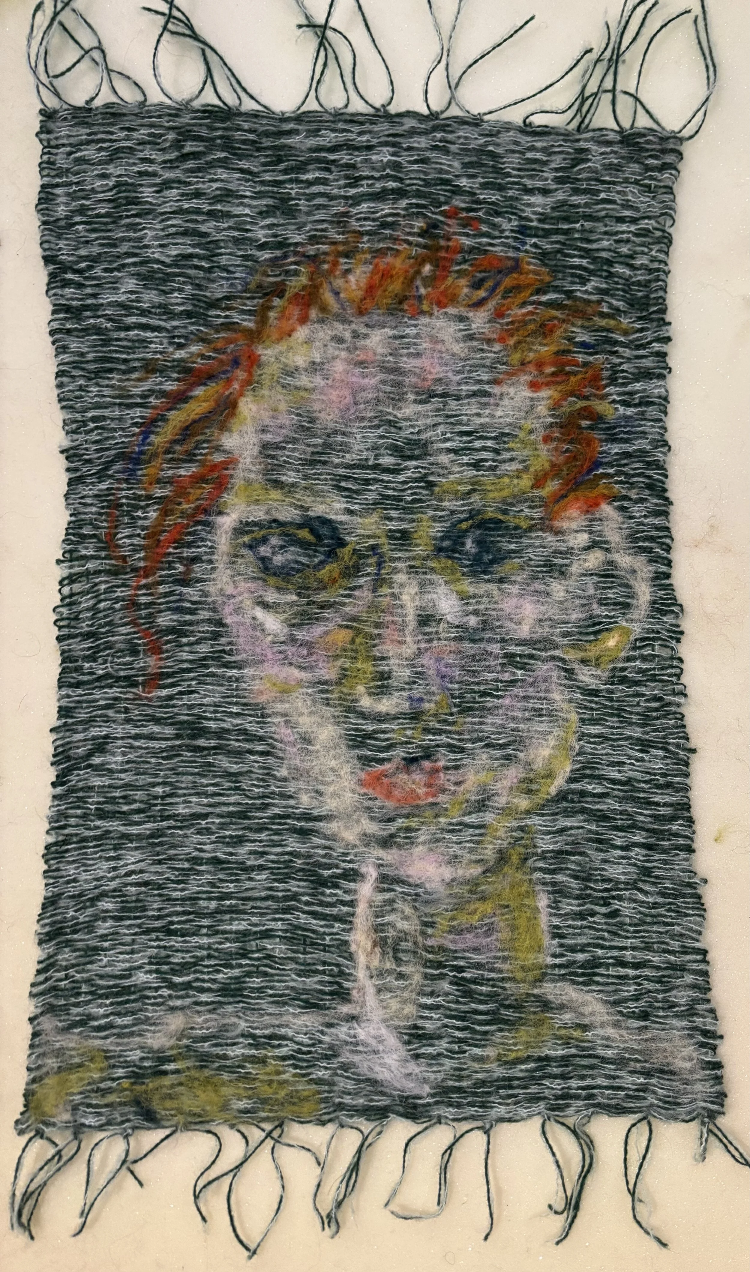 Woven and needle felted portrait