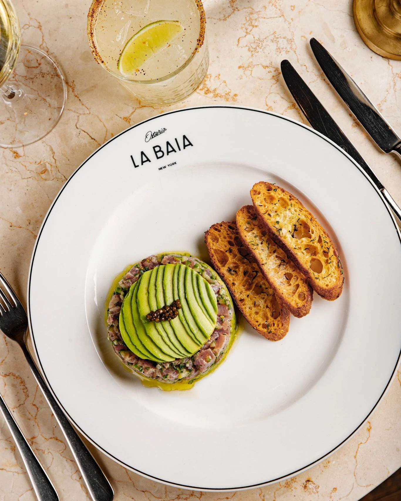 Tuna Tartare &mdash; yellowfin tuna, kaluga black caviar, ponzu ginger, avocado, cucumber. 
Bright flavor, clean texture, elegant finish.