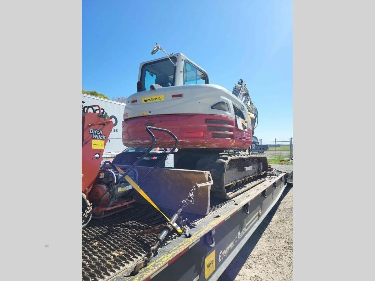 excavator on the way to yet another job. 