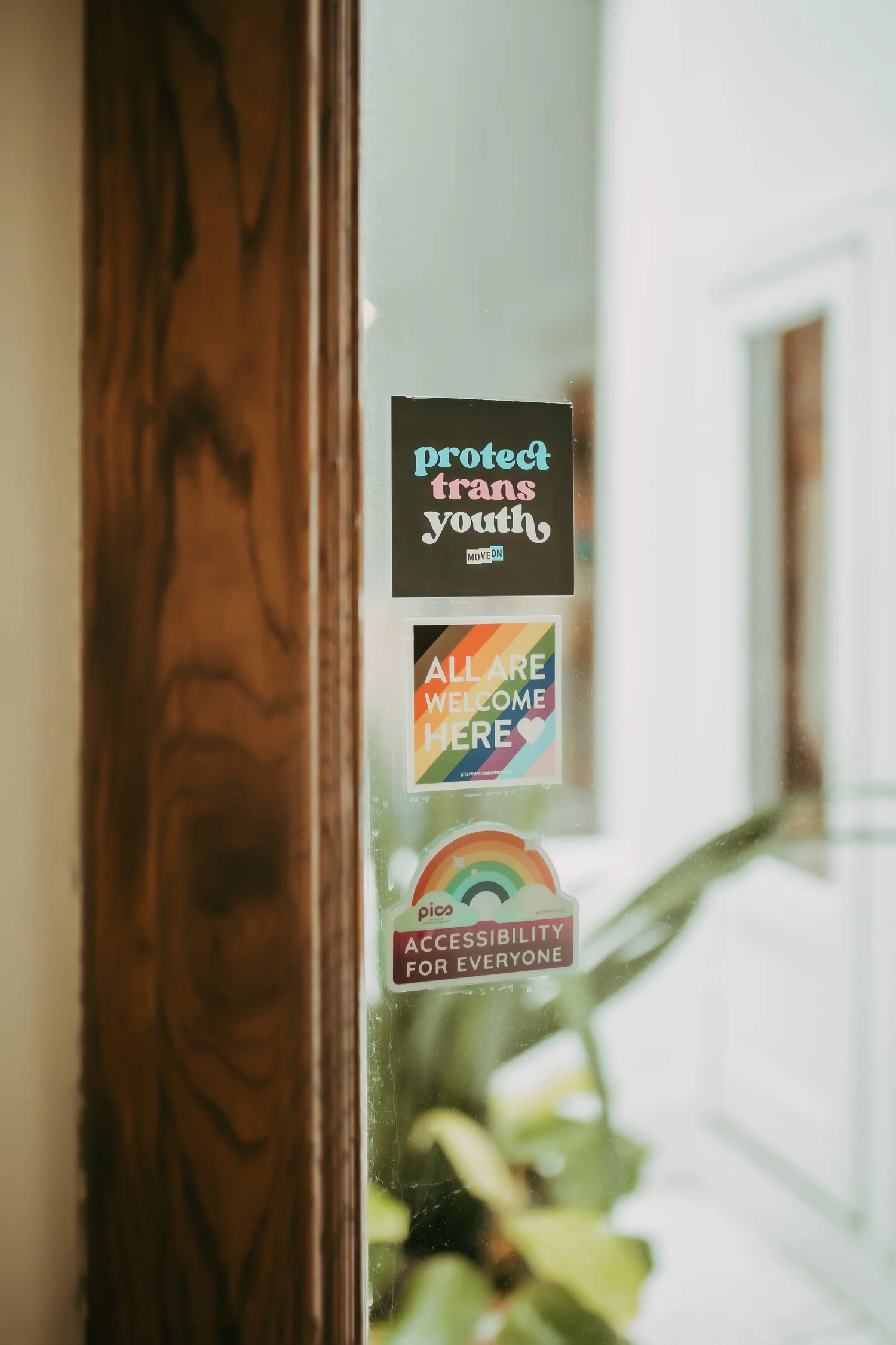 Inclusive and accessibility stickers displayed at the OCDMN office