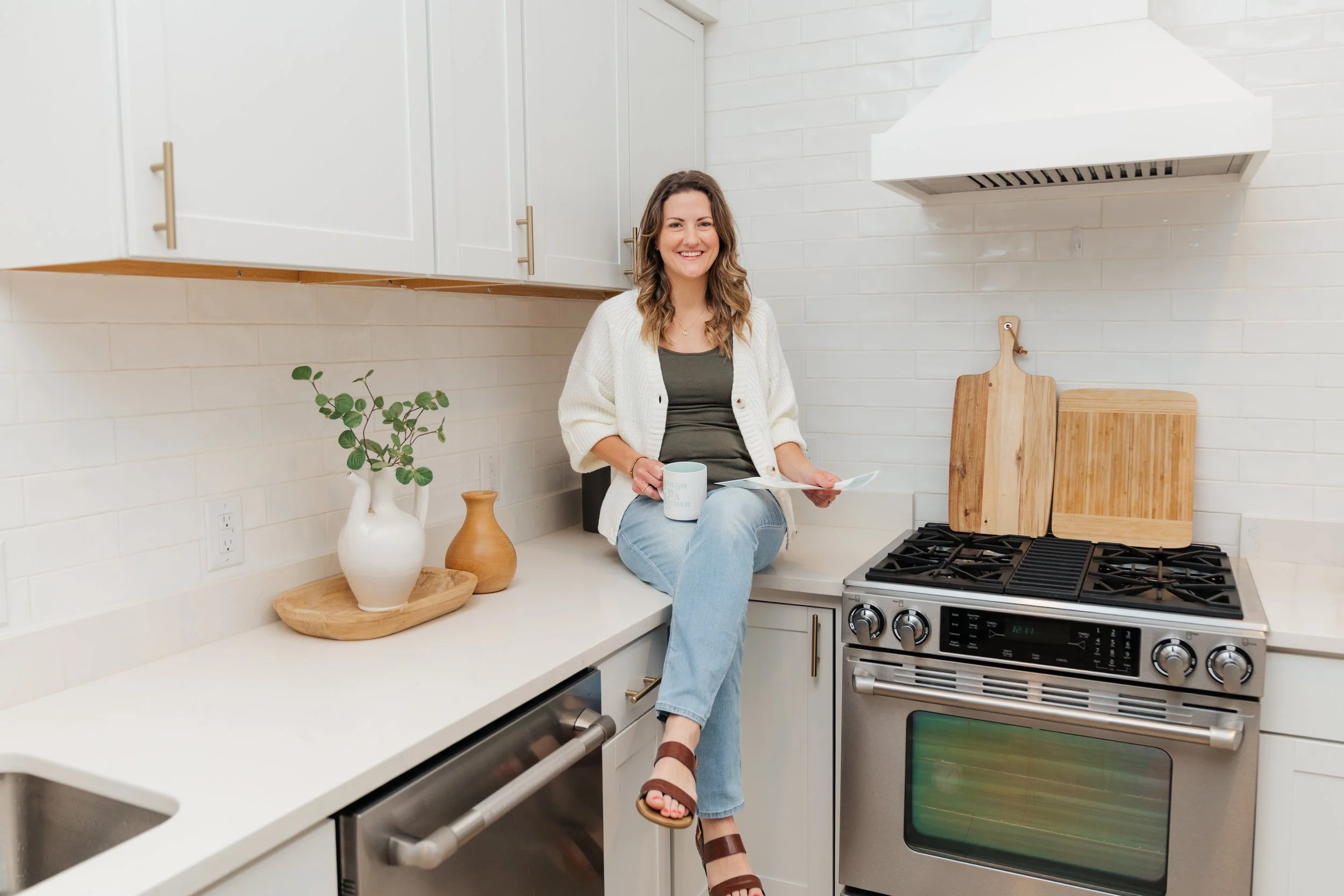 woman sitting on kitchen counter