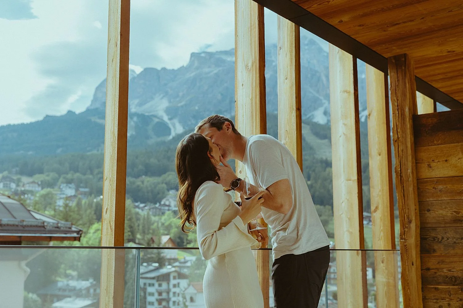 Couple sits on balcony in Cortina d'Ampezzo
