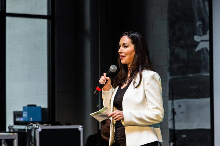 Brooke Hall speaking on stage