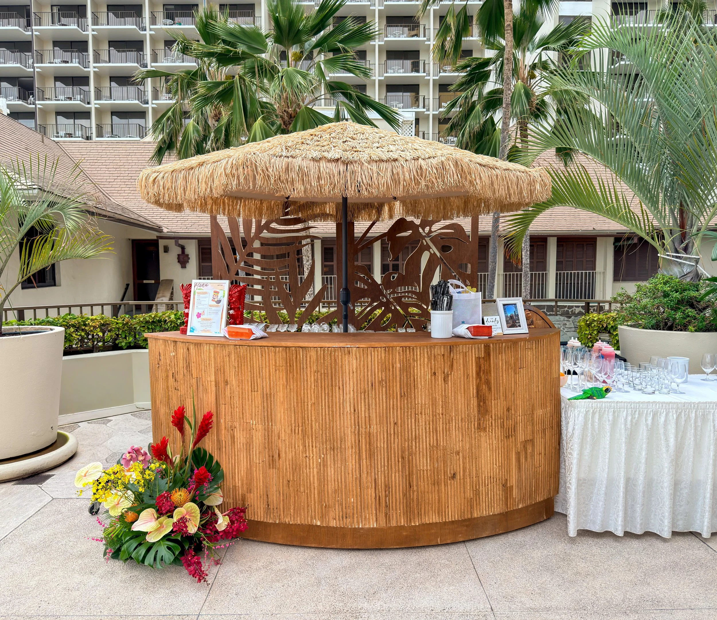 Bamboo Bar with Thatched Umbrella and Monstera Backdrop