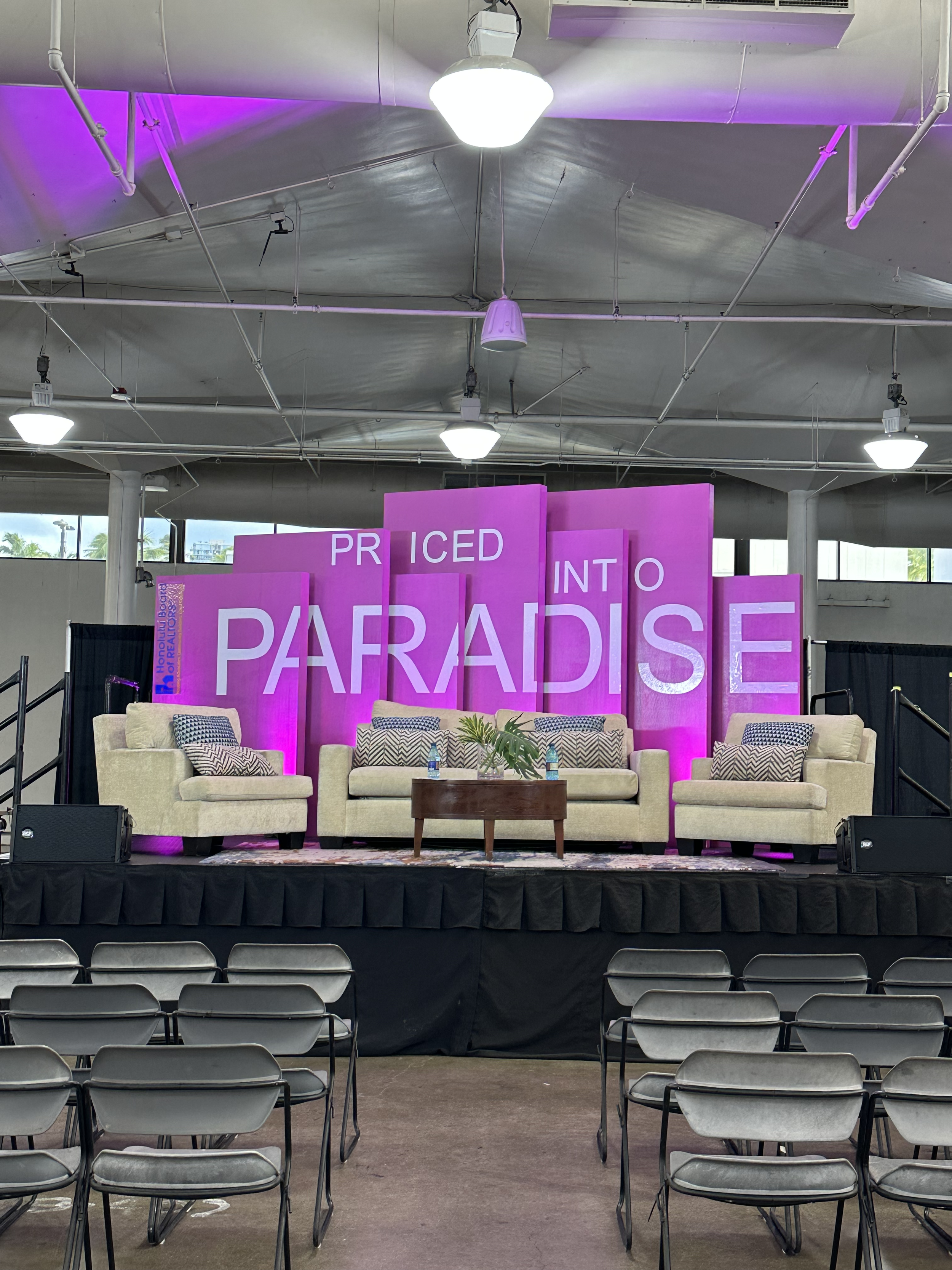 Priced-into-Paradise-2025-Panel-Backdrop.png