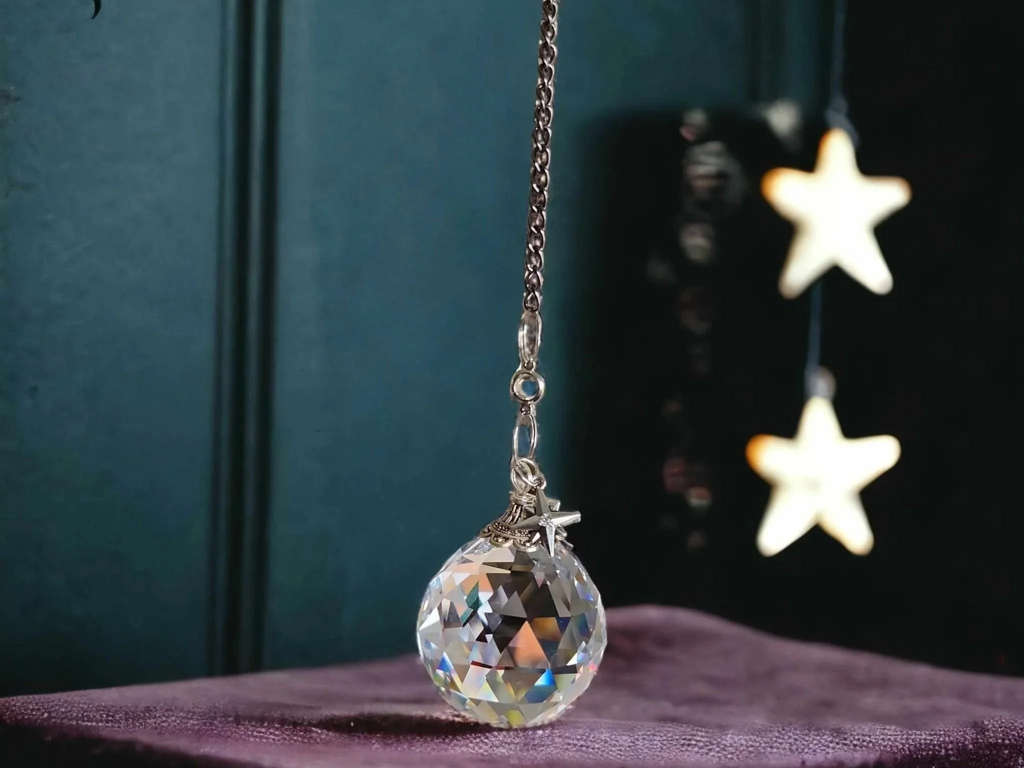 Handmade crystal sun catcher in window light