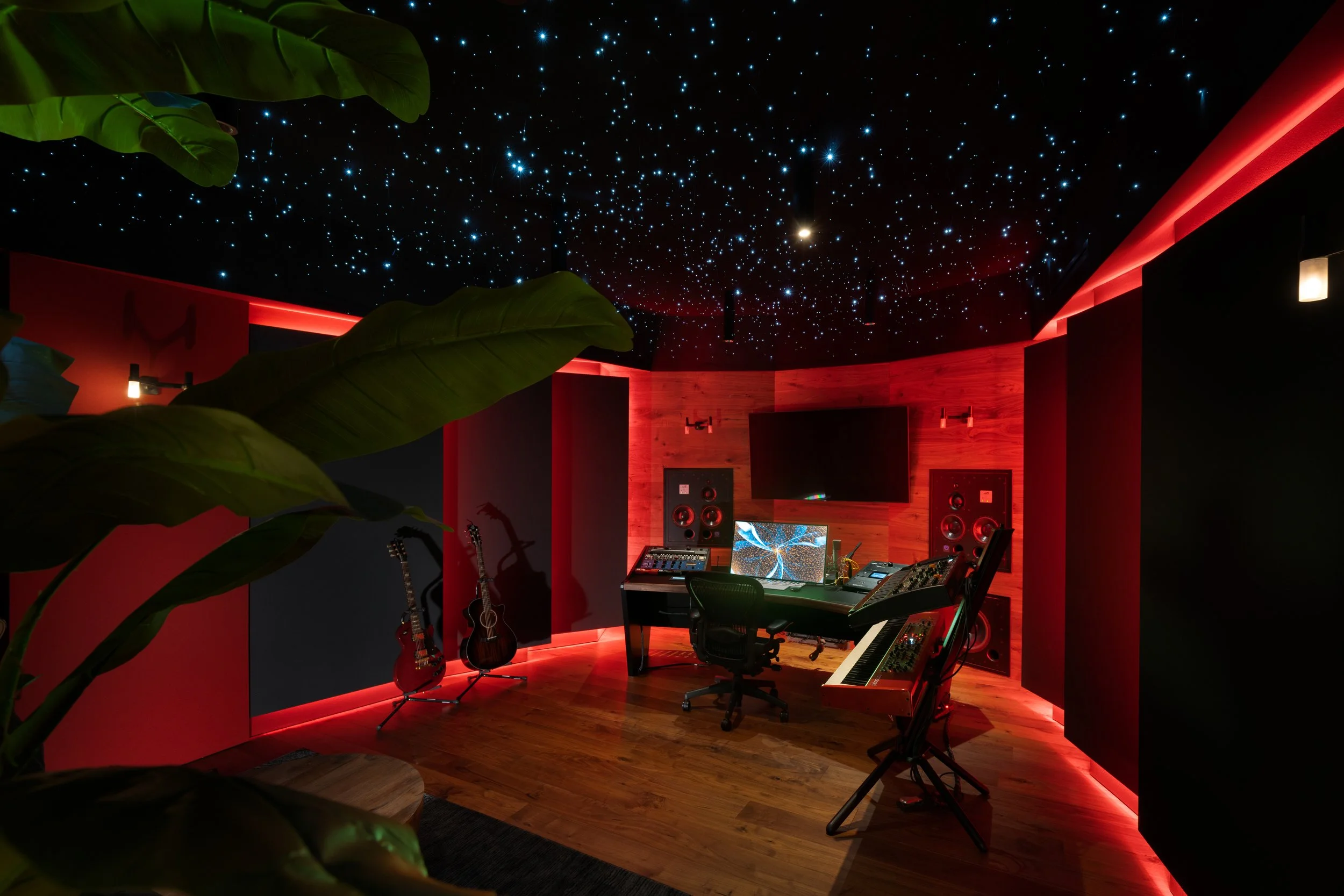 Zedd 1 control room with red lighting and an LED starry sky installation on the ceiling. Front wall viewed from back of room