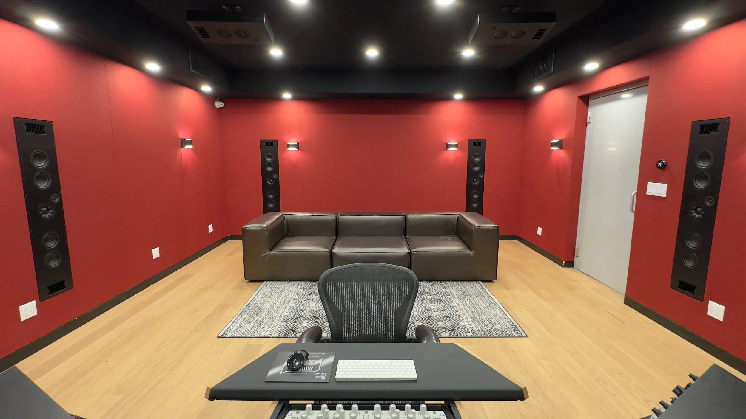 Full view of rear of Paris Lee Mastering atmos studio viewed from the front wall