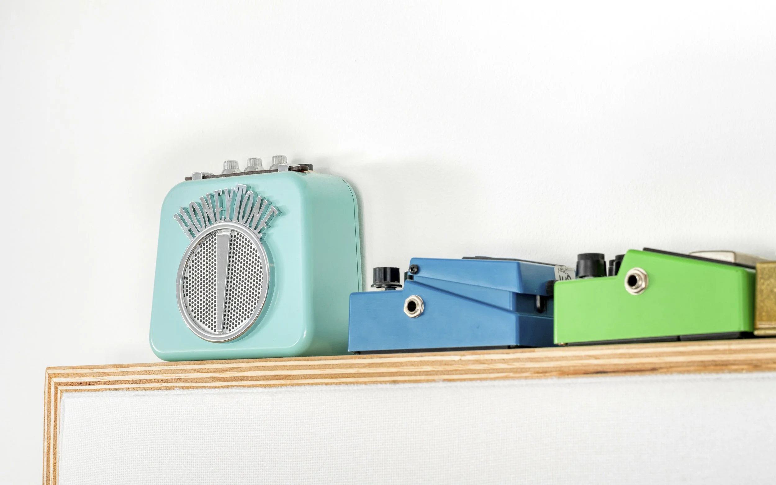 Interior of Chris Lyon studio, detailed closeup of guitar pedals