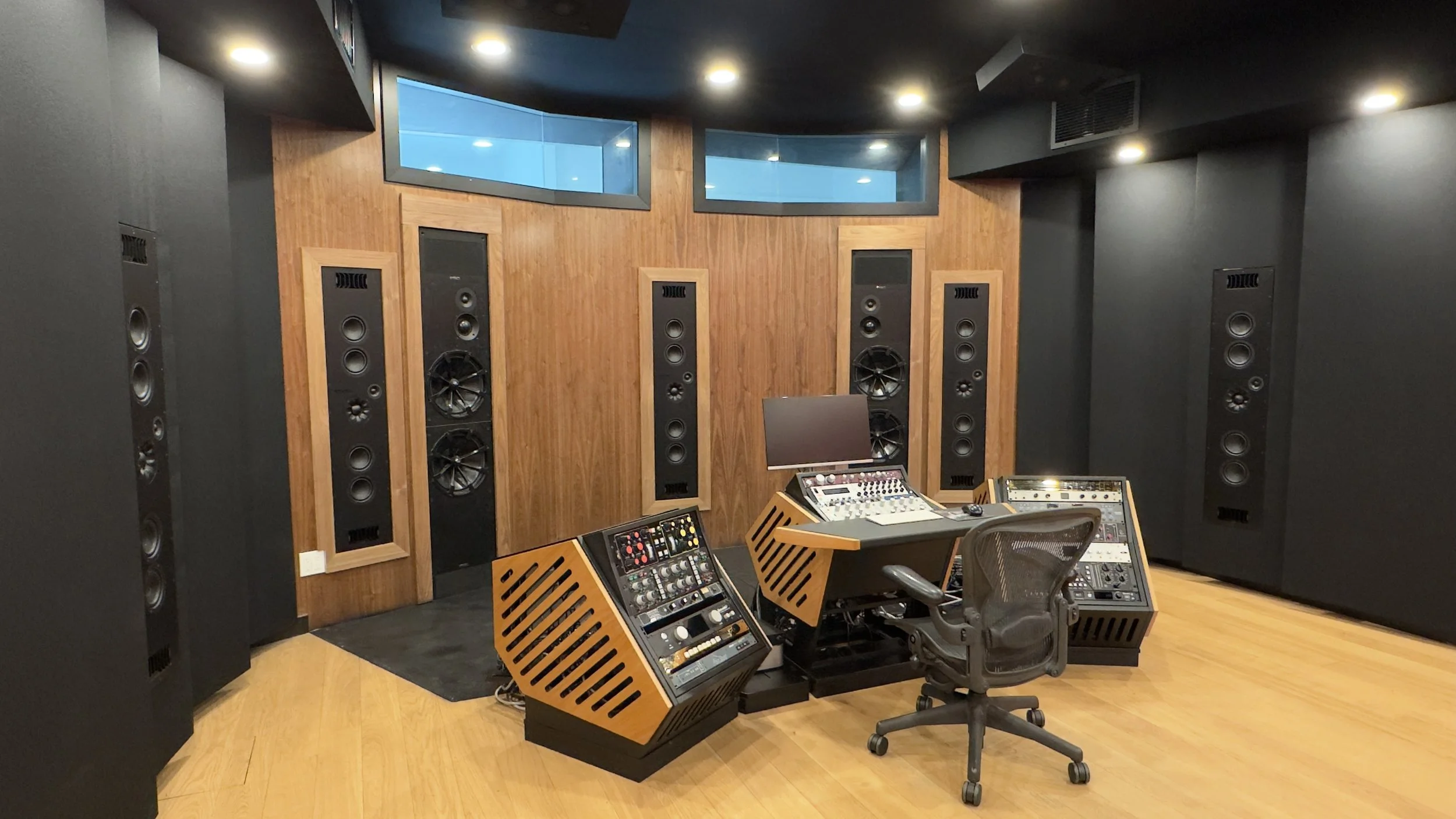 Front wall of Paris Lee Mastering atmos studio viewed from the side of the room