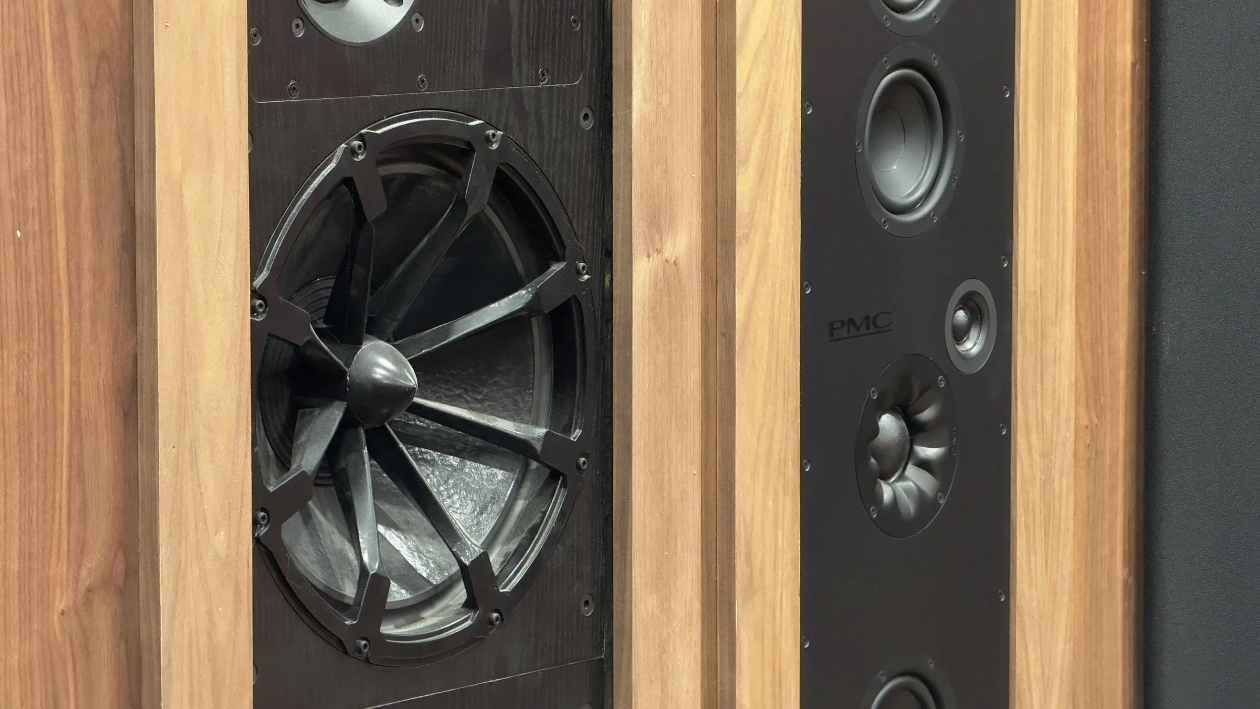 Close up of PMC BB6 speaker and atmos surround speaker on front wall