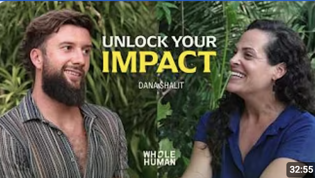 A man and woman smiling and talking outdoors with lush green leaves in the background. The text on the image reads, "Unlock Your Impact" and "Whole Human."
