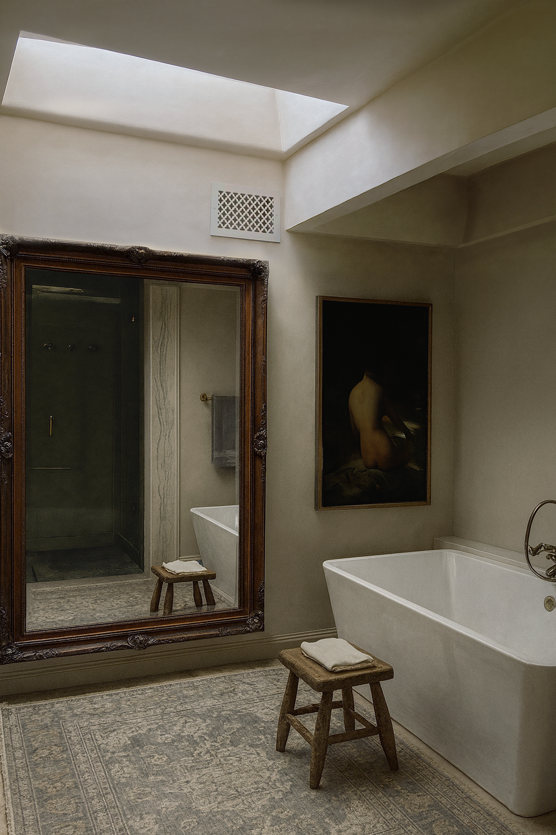 Residential bathroom renovation with skylight, freestanding bathtub, glass shower enclosure and warm natural finishes.