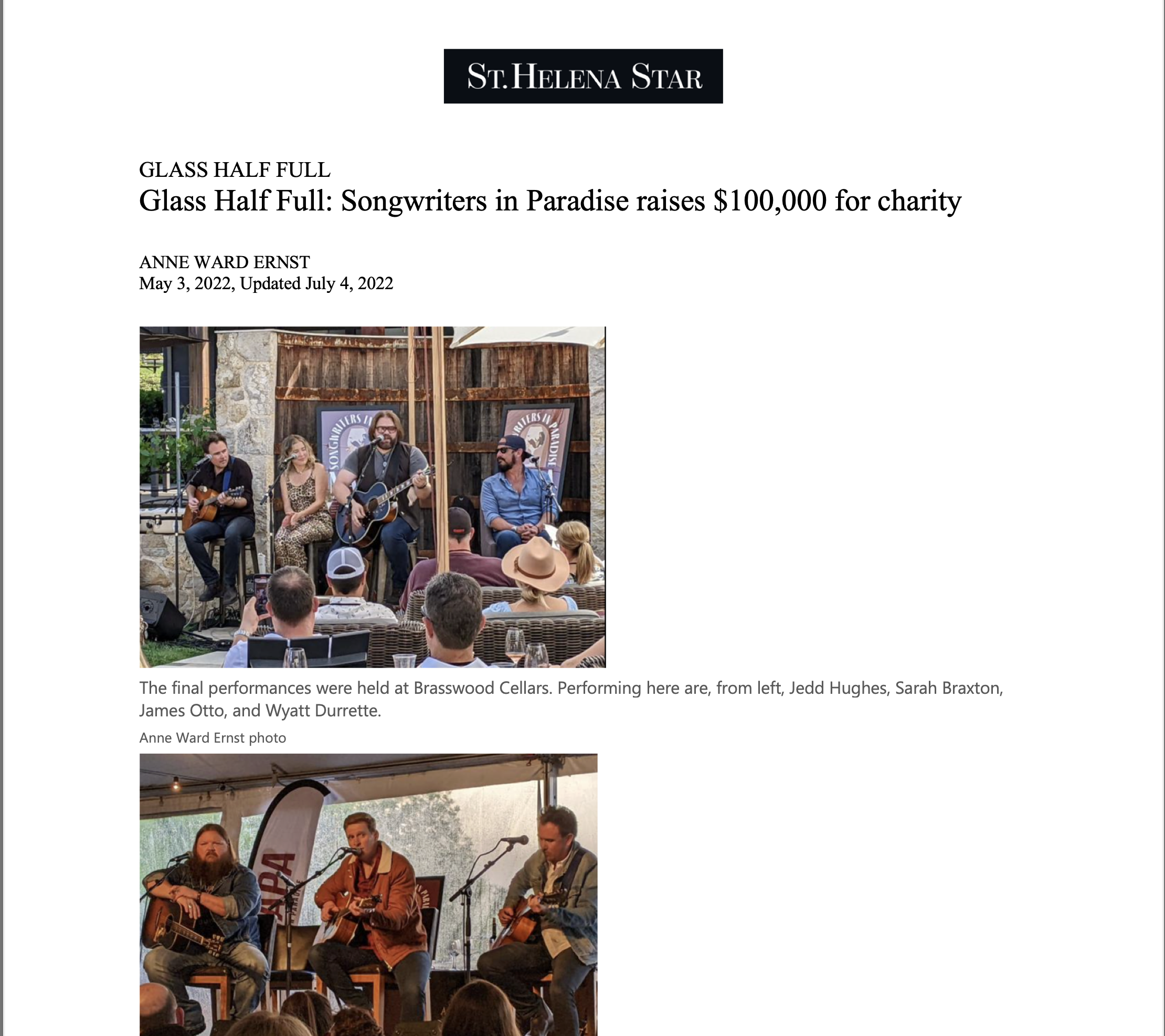 Photograph of a live outdoor music performance at Brasswood Cellars with four musicians playing guitars, audience seated, and banners in the background.
