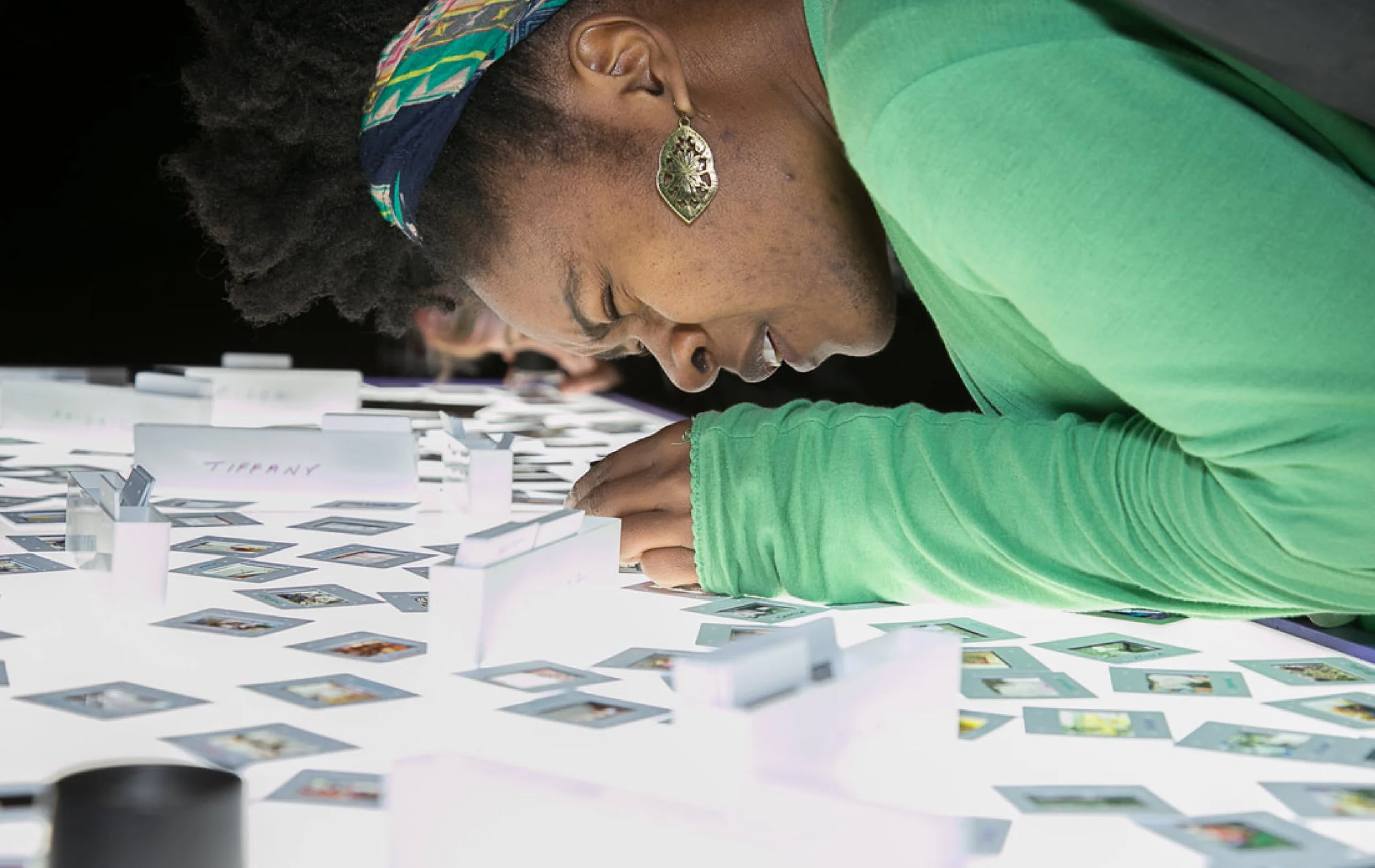 Woman viewing interactive photo exhibit