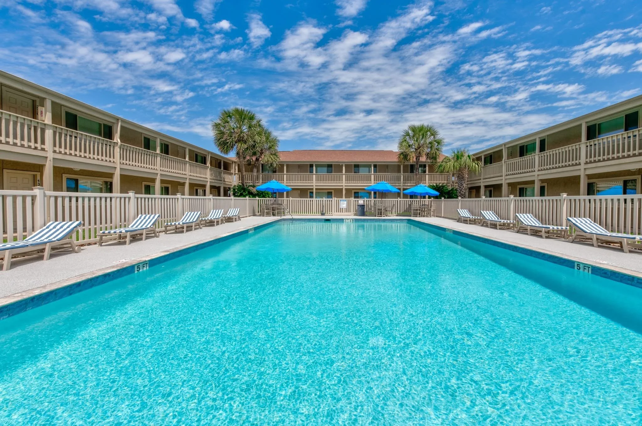 A clear swimming pool at Padre Island beach rental stays