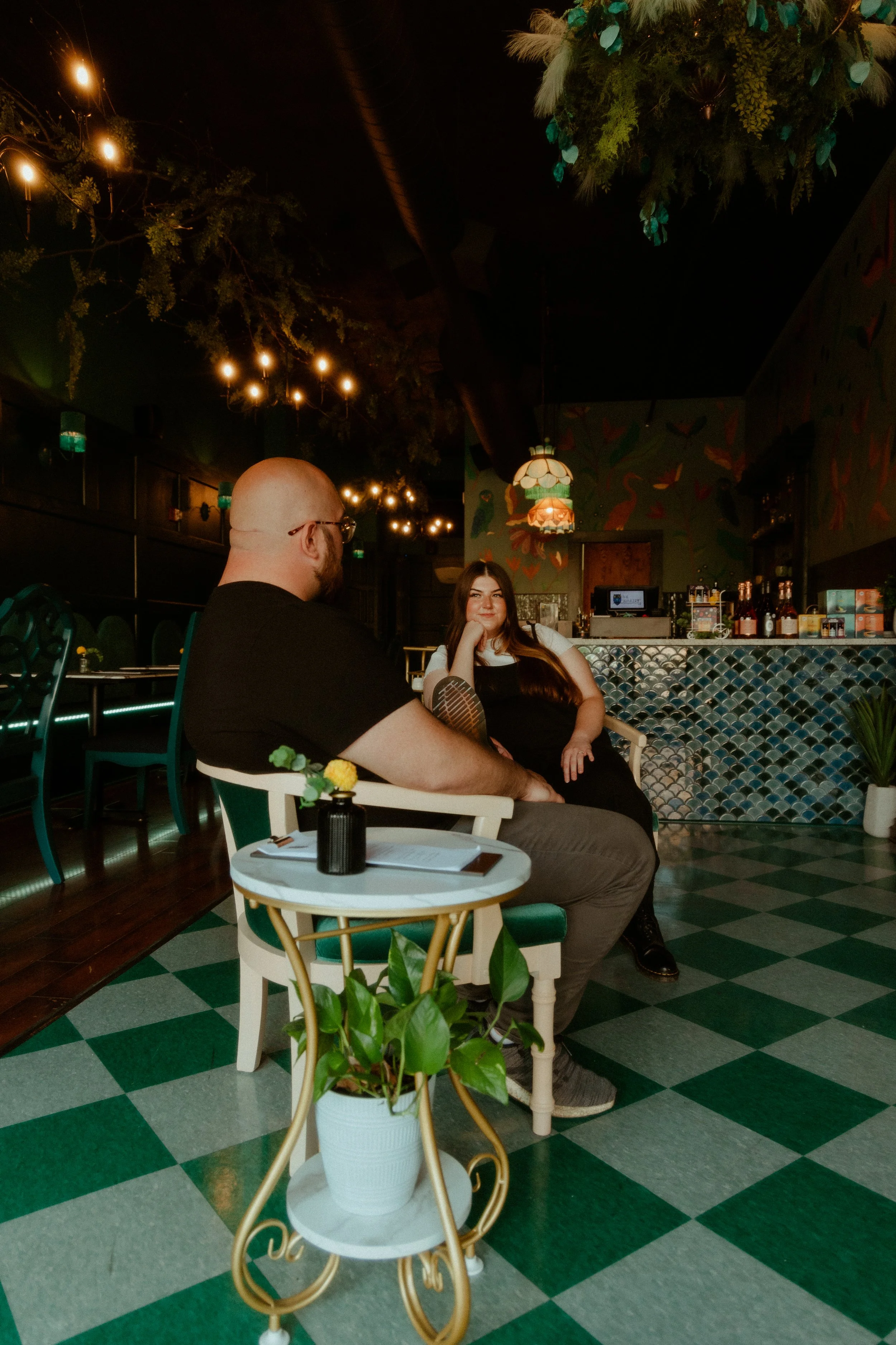 engagement couple sit in chairs at The Wakery dry bar in Springfield, IL