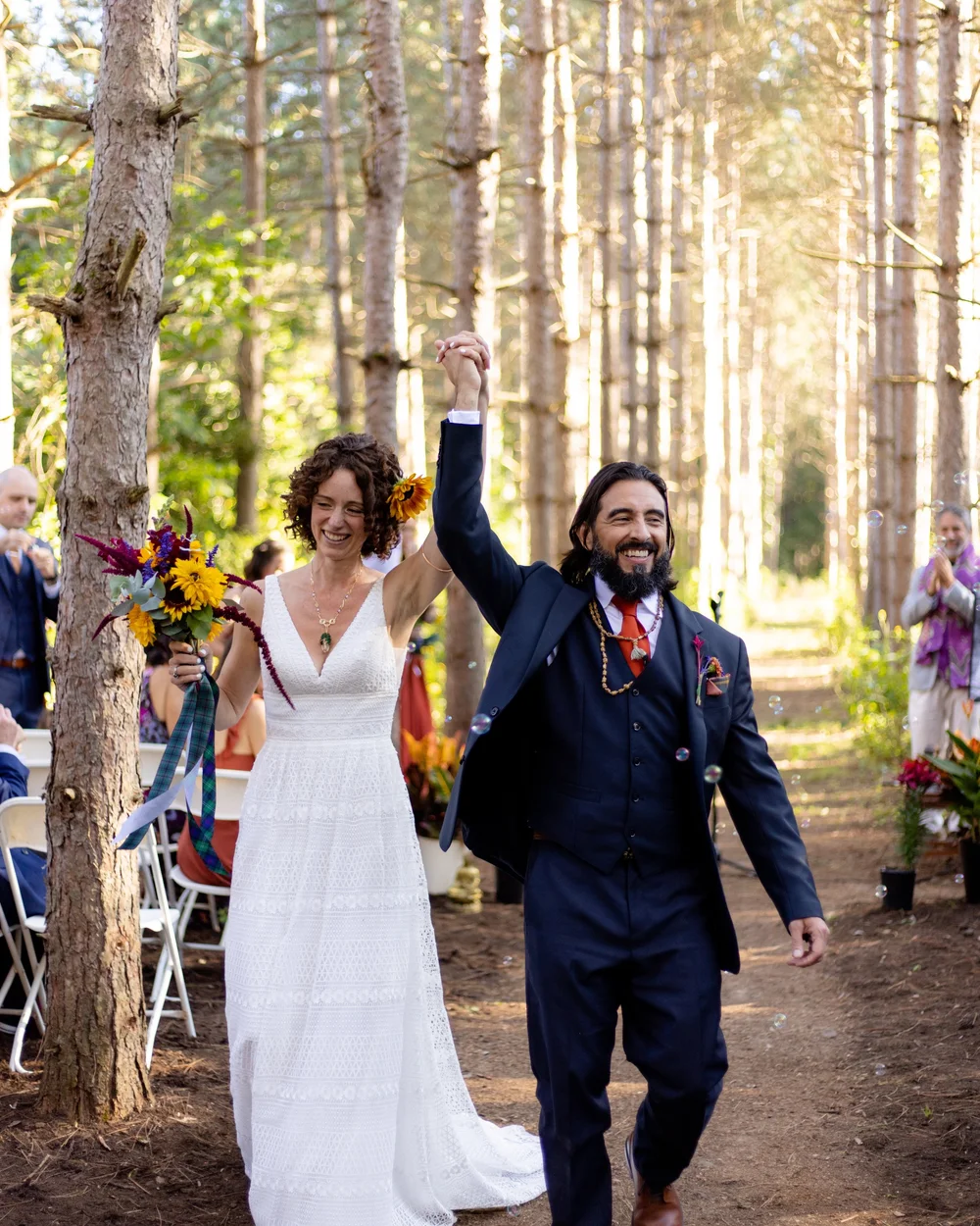 Lex and Shona walking back down the aisle on their wedding day