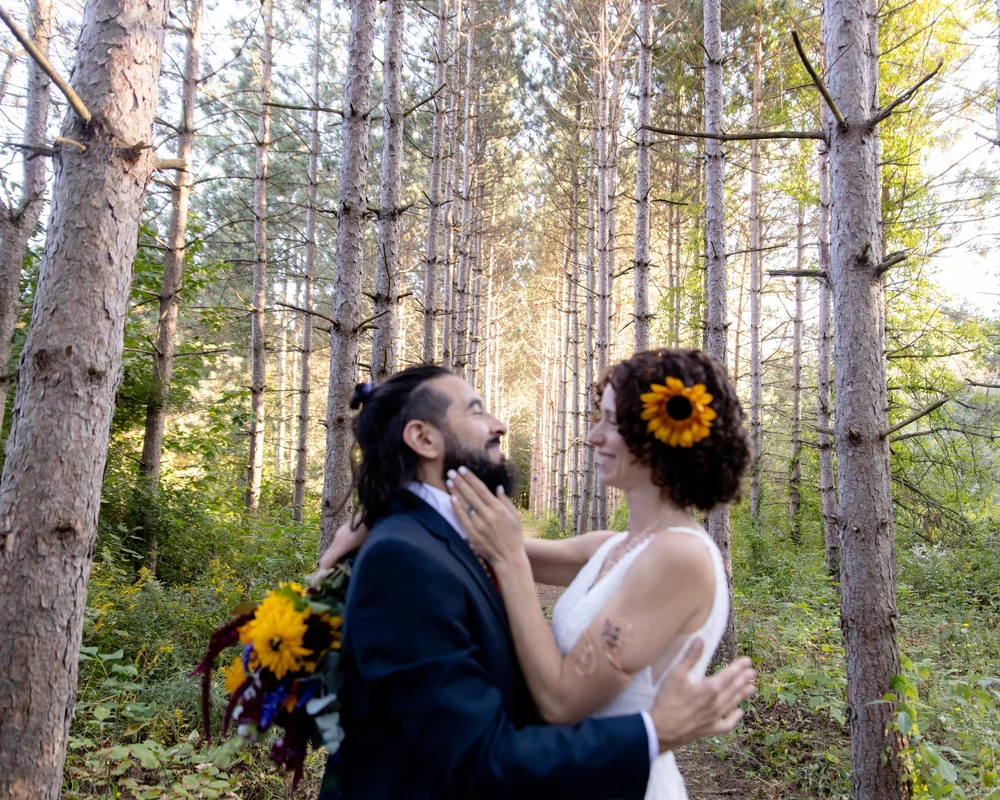 A wedding ceremony beneath the pines at Perry City Manors