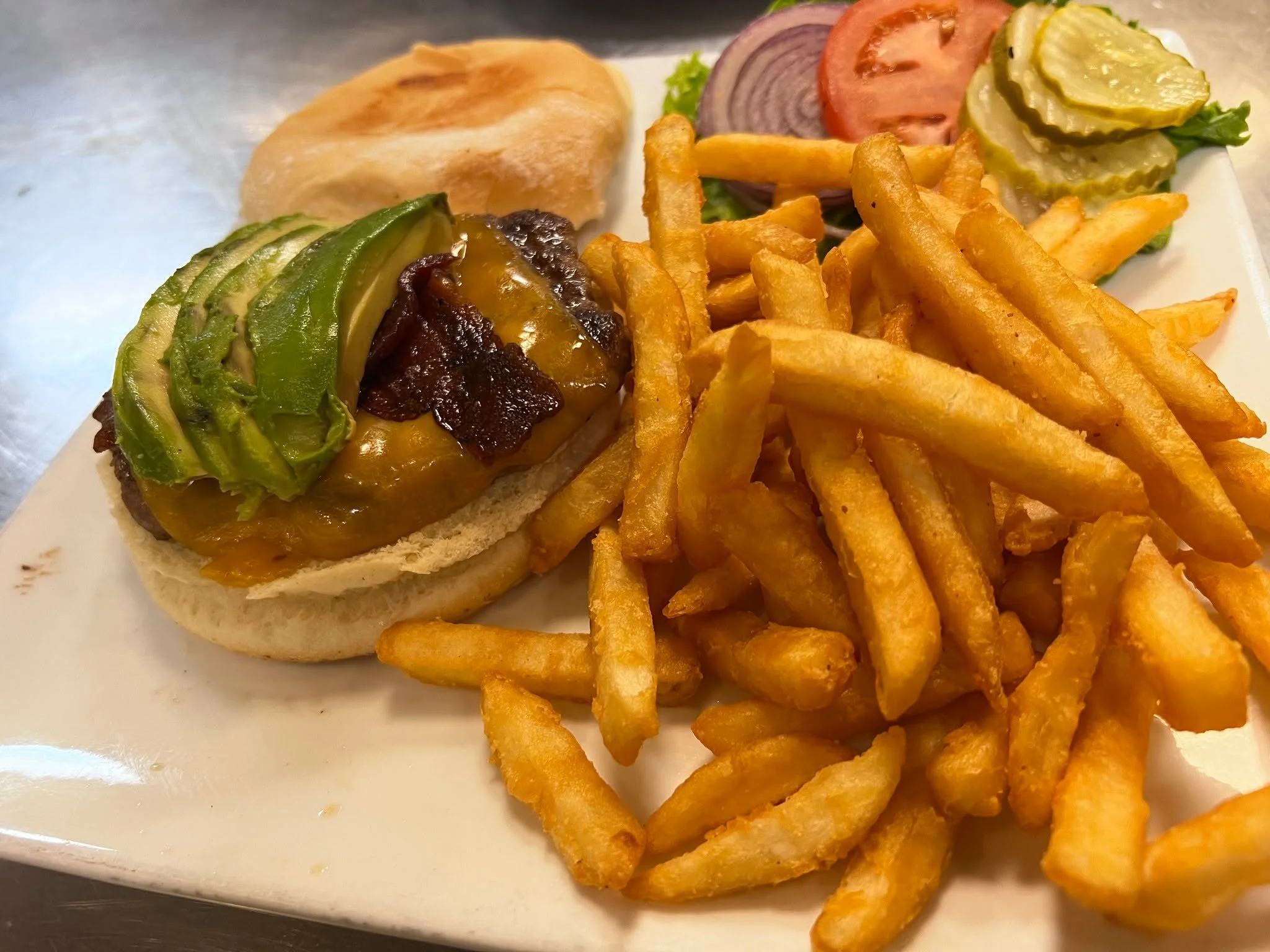 🥑 + 🍔 = ❤️ The Avocado Burger is calling your name. See you at lunch! 
Open 7 AM–2 PM daily.
Check out our menu now - link in bio!
#Elkodreez #explorenevada #familyrunbusiness #foodie #lunchbreak #brunchspot