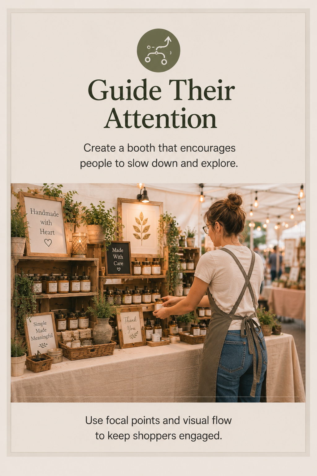 Vendor adjusting a craft booth display to improve visual flow and guide shoppers toward featured products.