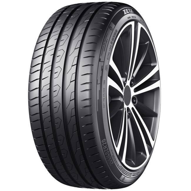 Close-up of a modern car tire mounted on a stylish alloy wheel, showing the tread pattern and sidewall details.