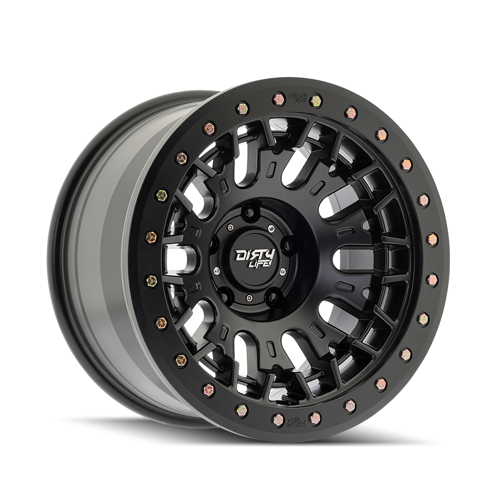 A black off-road wheel with a rugged design and colorful bolt accents around the rim, featuring the label 'Dirty Life' in the center.