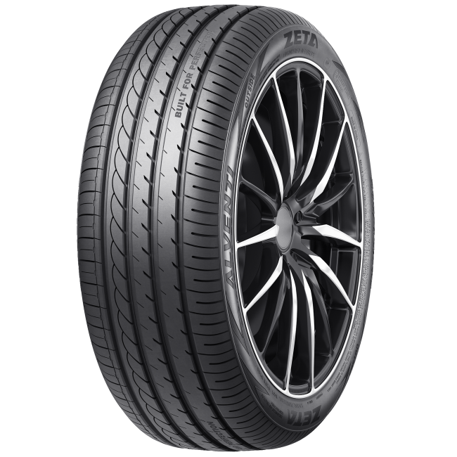 A close-up of a black car tire with a modern alloy wheel, showing the tread pattern and sidewall branding.
