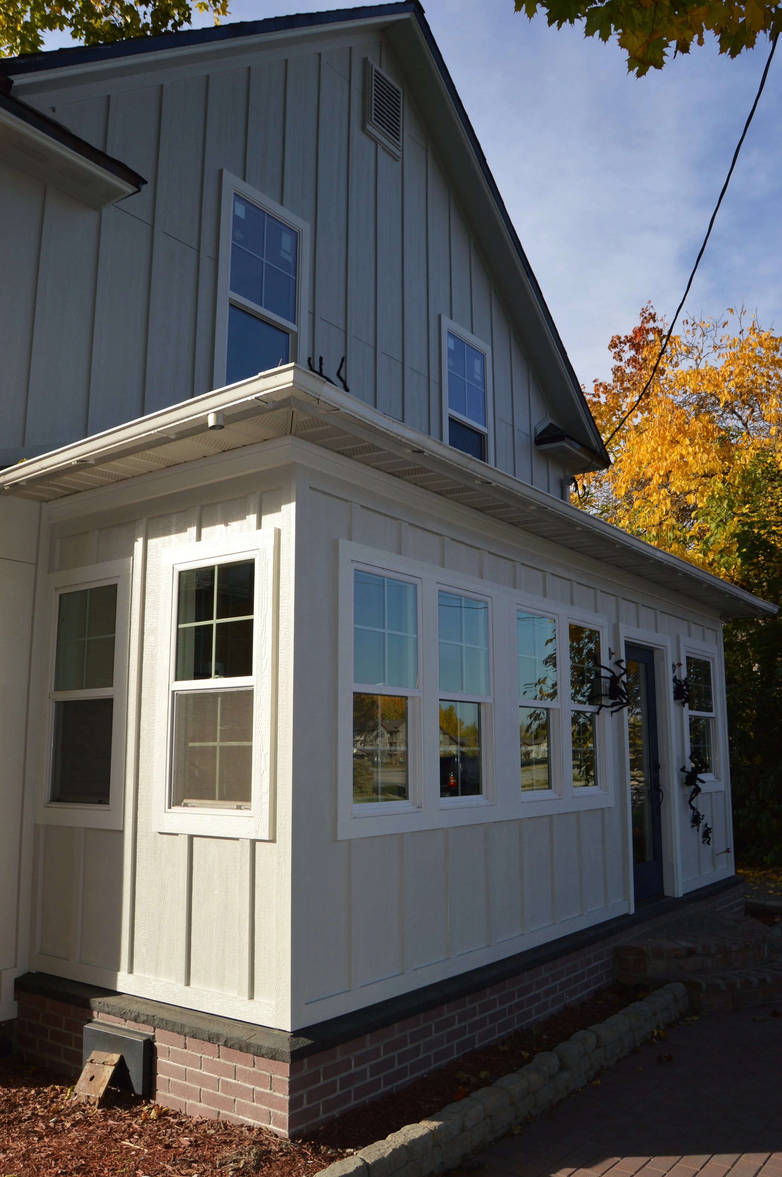 (After) LP Board & Batten Re-Side, Window Replacements, LP Soffit & Fascia (Painted)