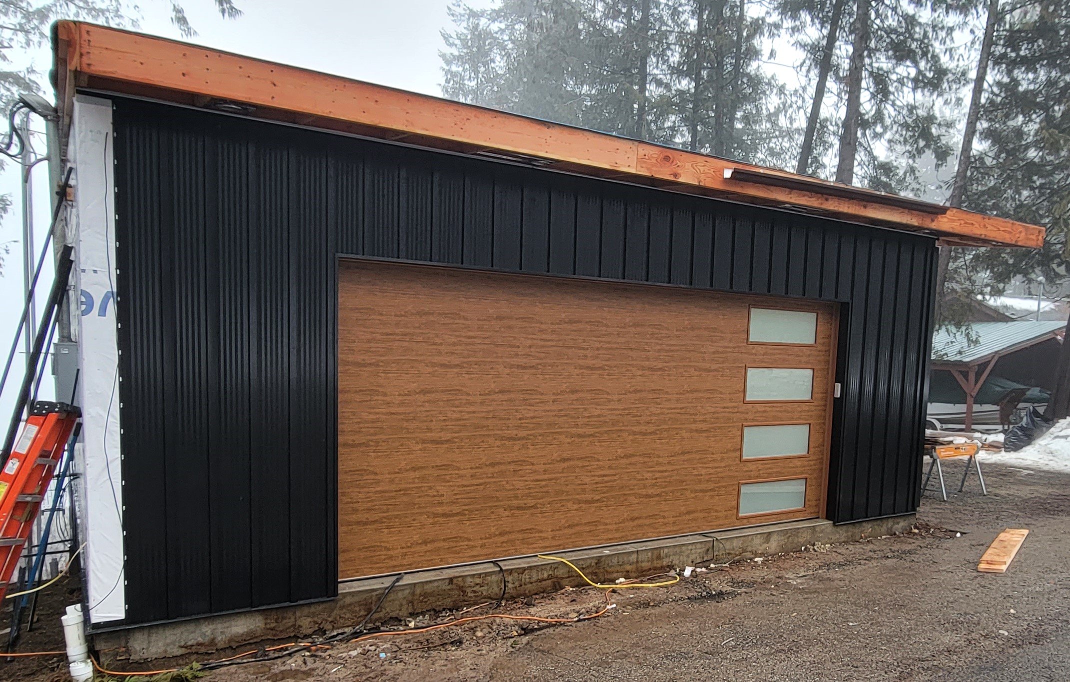 (During) Sheathing, Blueskin House Wrap, Window Installation, Metal Board & Batten Siding, Metal Soffit & Fascia