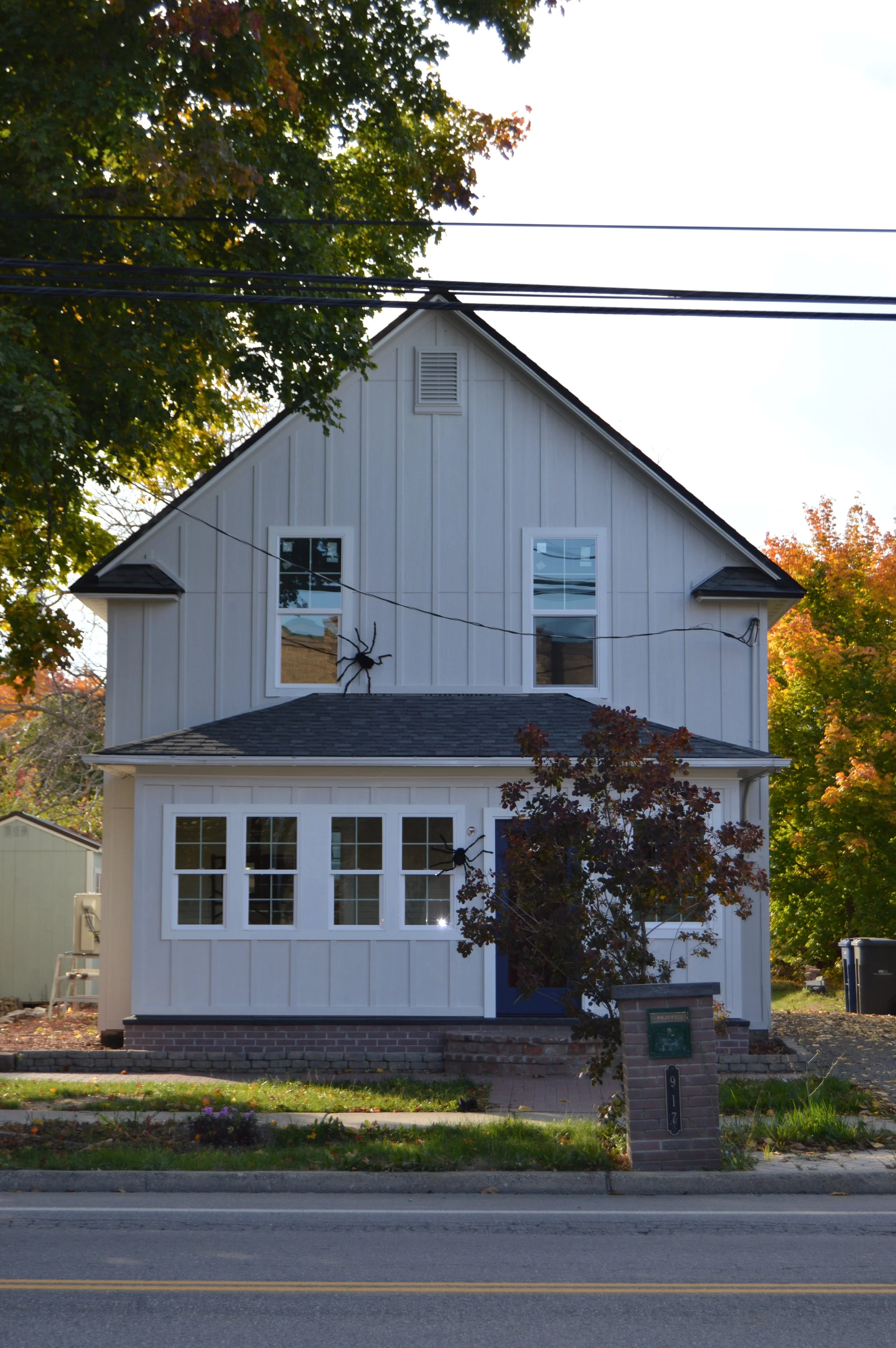 (After) LP Board & Batten Re-Side, Window Replacements, LP Soffit & Fascia (Painted)