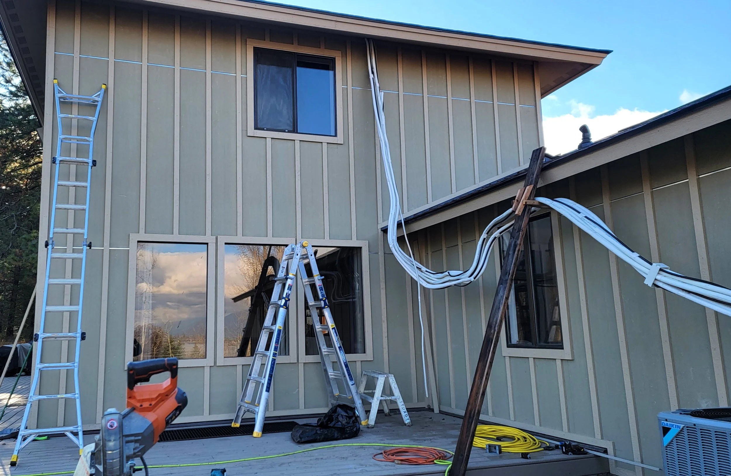 (After) Re-side: Hardie Board & Batten, Cedar Shiplap on Sunroom, Hardie Shake Accents, LP Trim & Soffits, Cedar Tongue & Groove Soffits