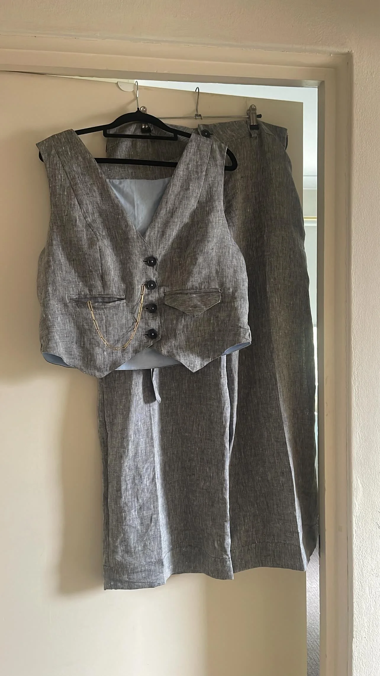 grey vest hanging.jpeg
