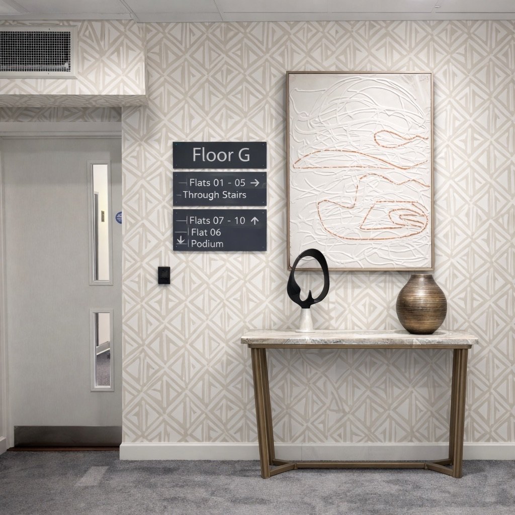 Design visual of a communal corridor with geometric wallpaper, artwork and a marble console