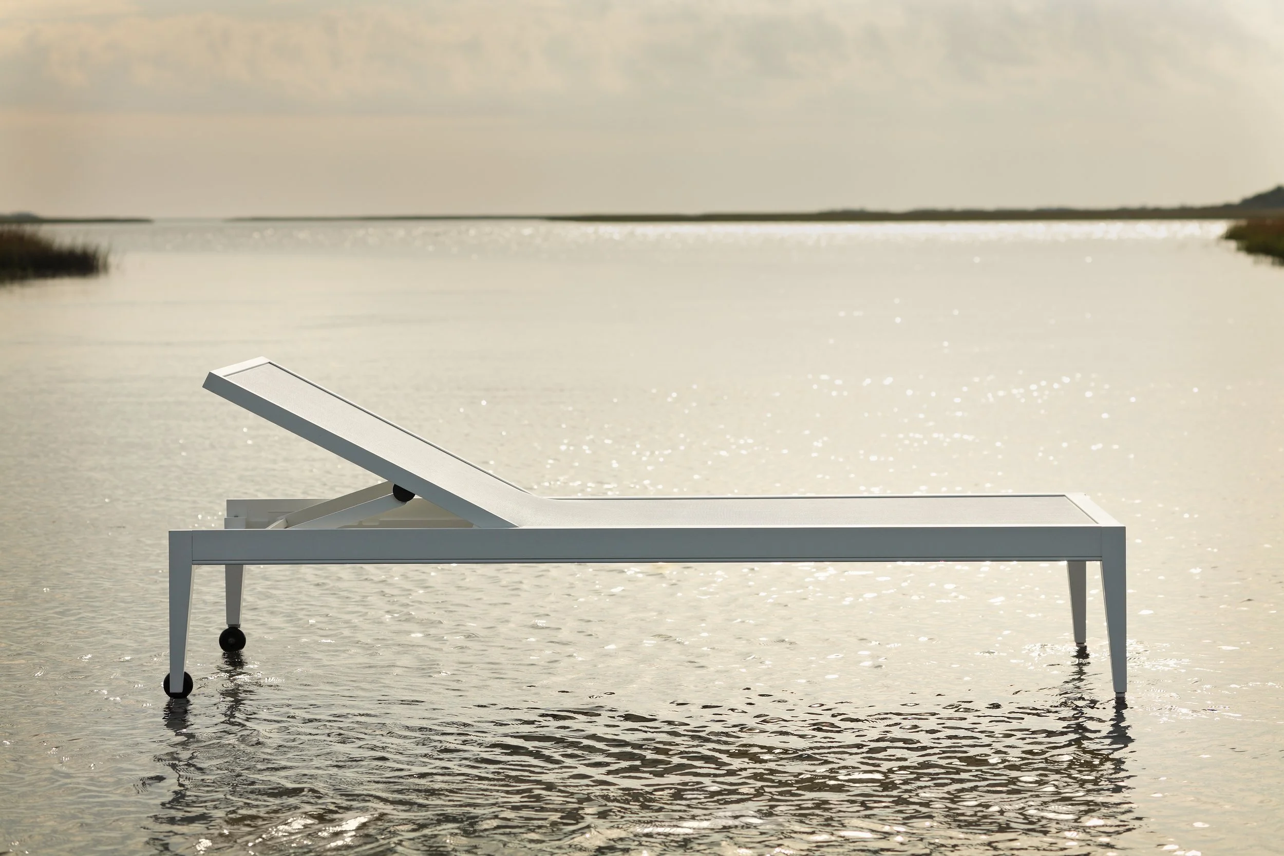 mckinnon-and-harris-luxury-hospitality-poolside-chaise-lounger-sparkling-water-by-kip-dawkins