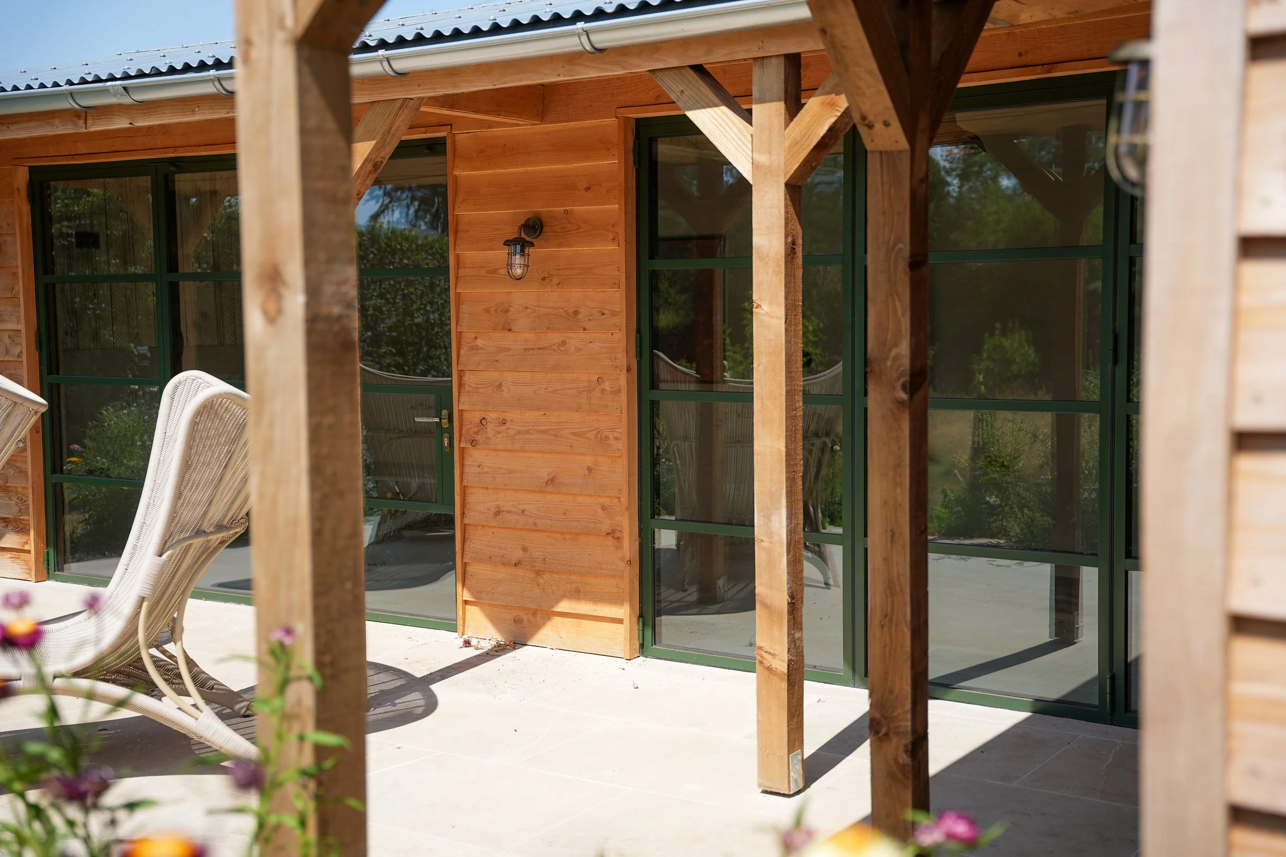 Cedar clad outbuilding with origin bi fold doors