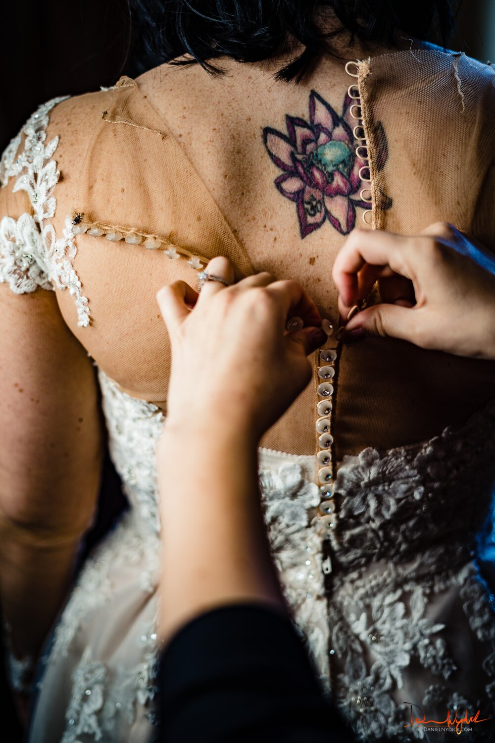 tattoo nj bride getting wedding gown buttoned