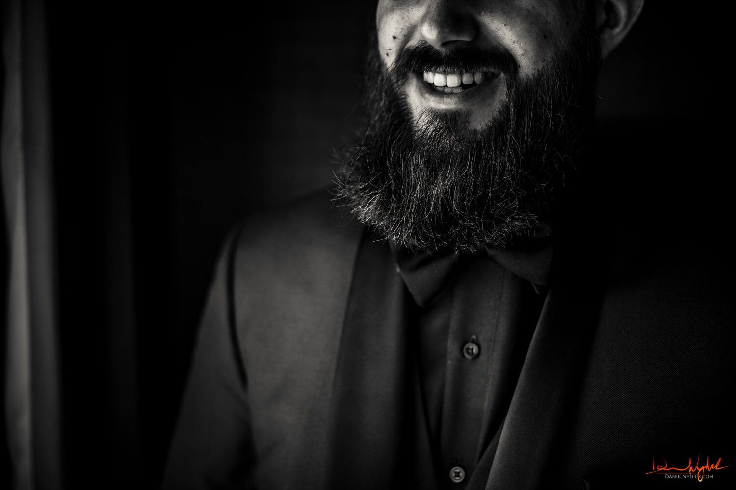 groom smiling up close nj halloween wedding black and white