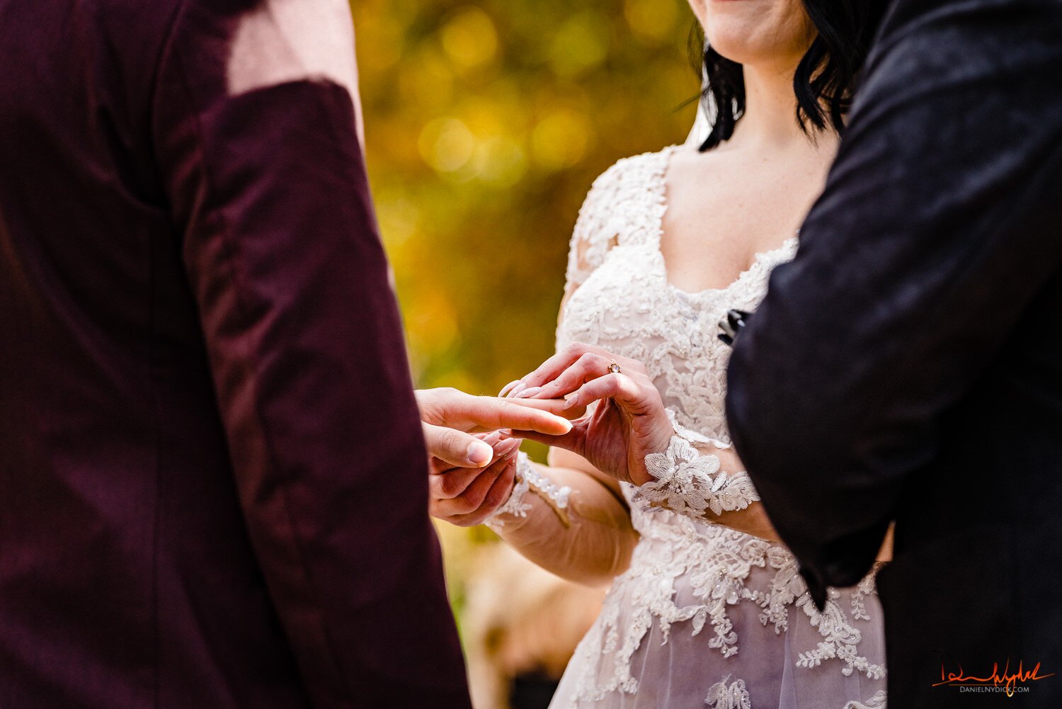 nj pinup goth bride putting ring on groom's finger during nj hal