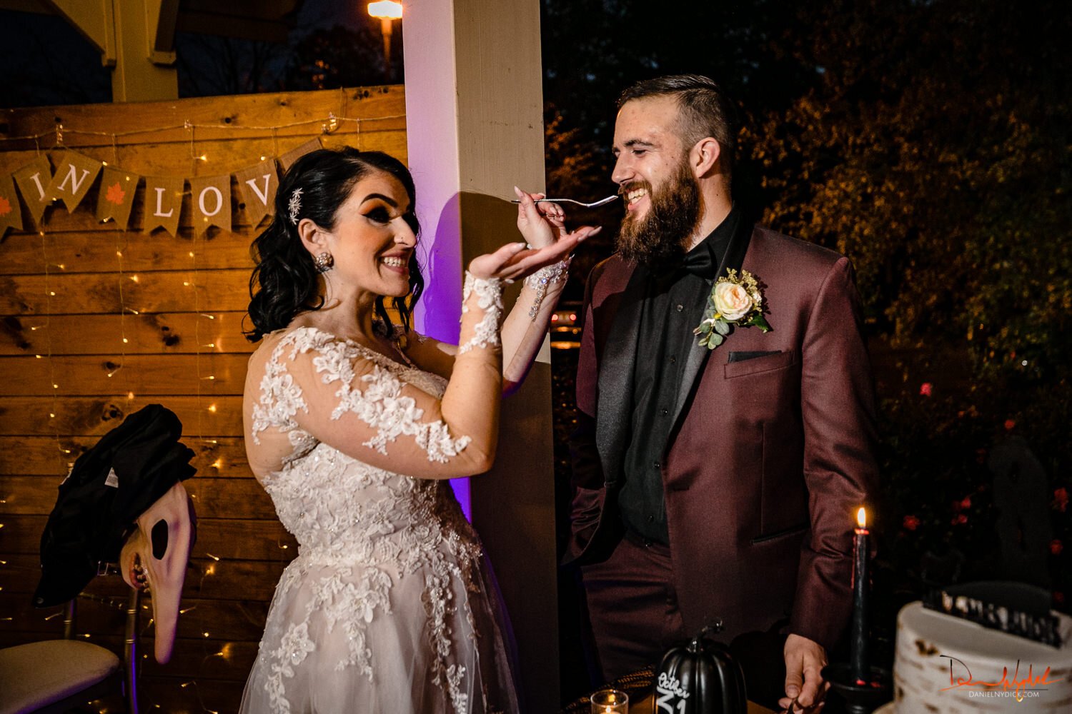 nj pinup goth bride feeding groom cake  at halloween wedding