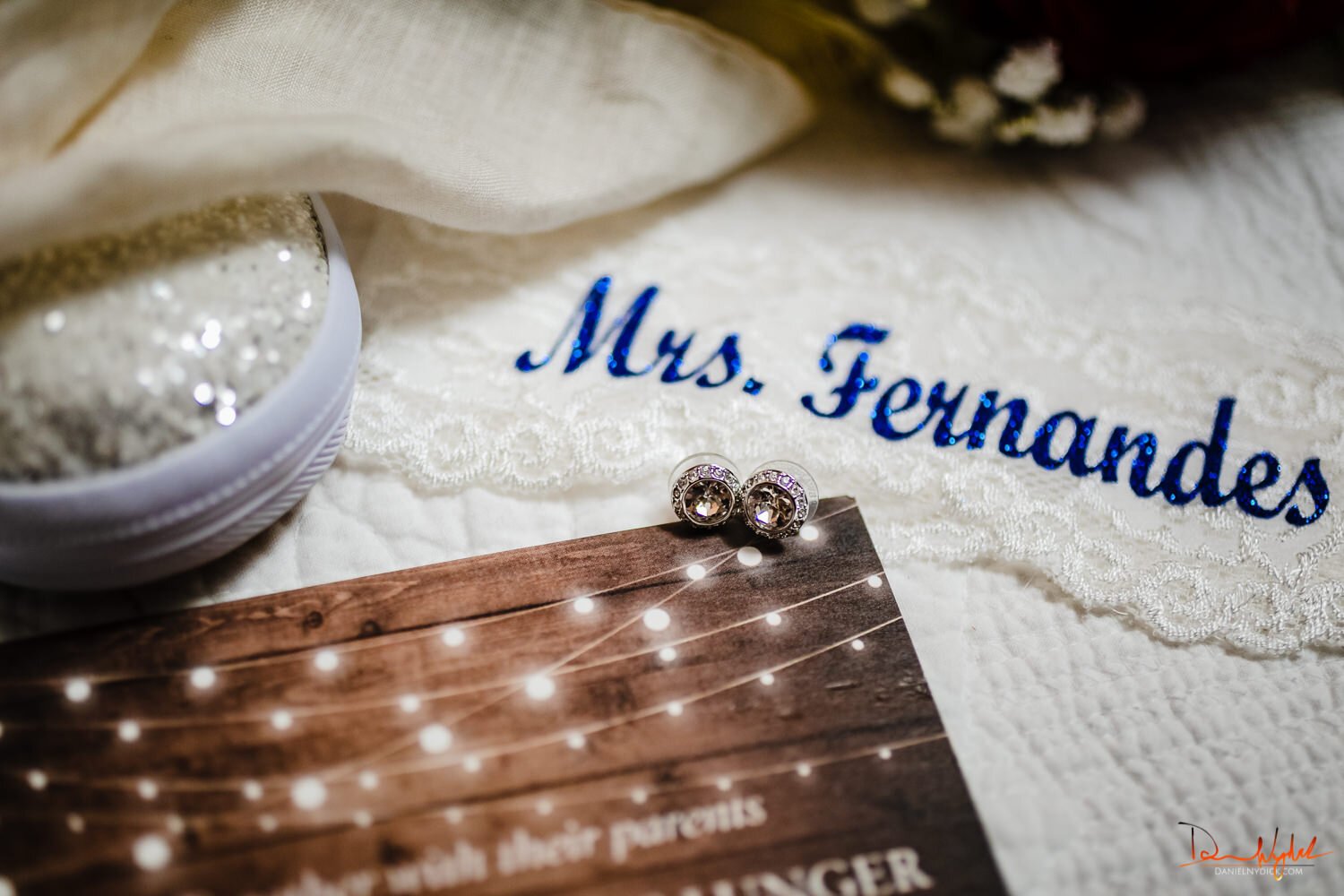 bride's earrings garter and invitation details 