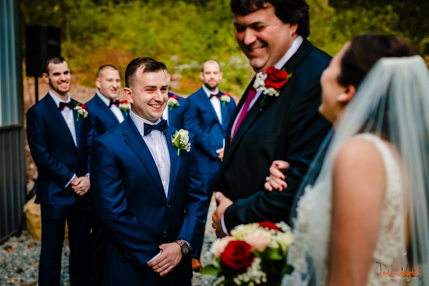 smiling groom sees bride while dad laughs nj rustic barn wedding