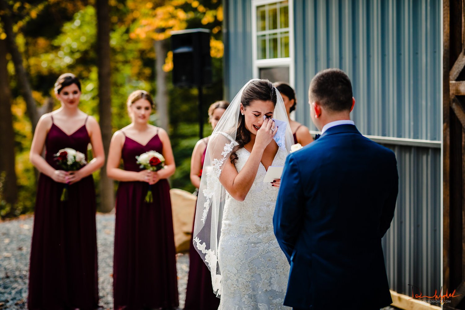 bride crying at altar in rustic nj barn wedding
