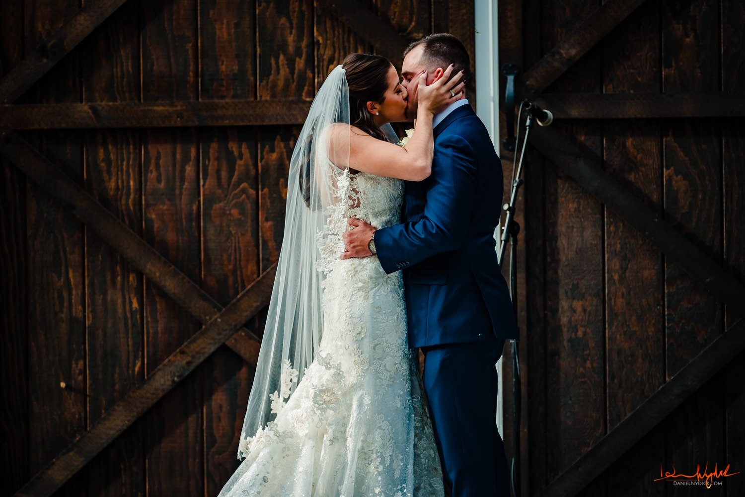 first kiss as husband and wife at nj barn wedding
